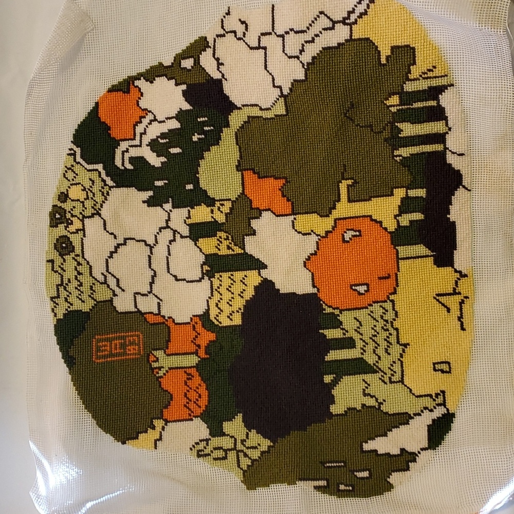 Woven tapestry originally for John Deere tractor seat cover.